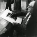 Henry Moore checking the tapestry <i>Mother and Child: Interior Background</i> against the orig…