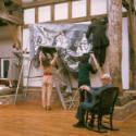 Henry Moore overseeing the installation of <i>Three Seated Figures</i> in the Aisled Barn, Perr…