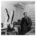 Henry Moore with <i>Family</i> in the Top Studio, Perry Green, 1949. The horizontal bar of wood…