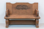 One of the two chairbacks fitted into the specially made bench, on display in <i>Becoming Henry…