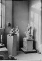 Henry Moore‘s studio, Parkhill Road, Hampstead:<br>
(L-R) <i>Girl</i> 1932 (box wood); <i>Mask…
