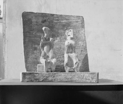 Two Seated Figures against Wall
