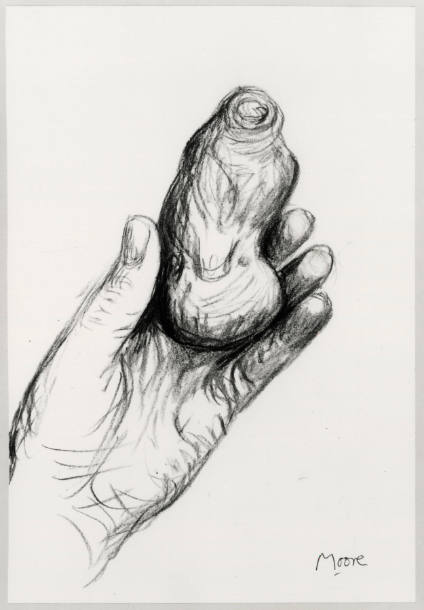 Artist's Left hand Holding Pebble