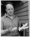 Henry Moore holding the individual maquettes for <i>Three Standing Figures</i> 1945 (terracotta…